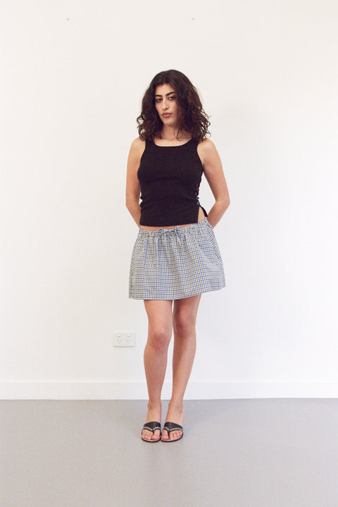 Mikaela is 5’3” and wears XS